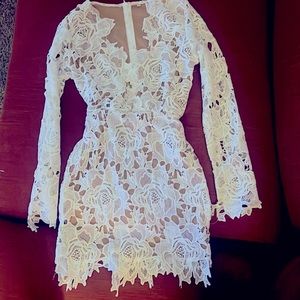 A medium size white lace mini dress.